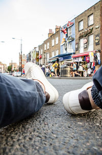 Low section of people on street in city