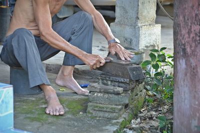 Low section of man working