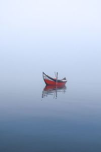 Boat in sea against sky