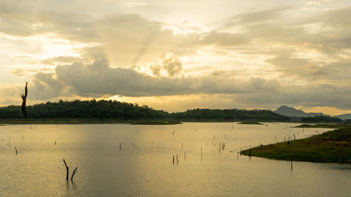 Scenic view of lake against sky during sunset