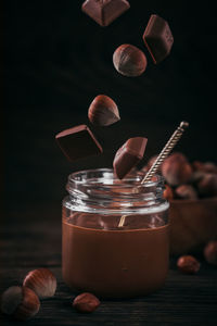 Homemade chocolate hazelnut milk spread on a dark background