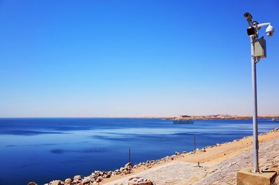 Scenic view of sea against clear blue sky