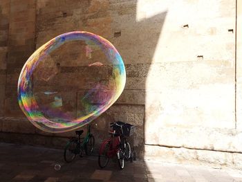 Bicycle parked against wall