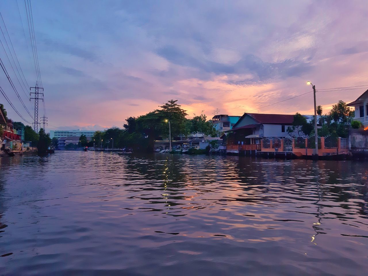 SCENIC VIEW OF RIVER AGAINST SKY AT SUNSET