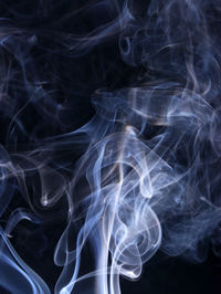 Close-up of smoke against black background