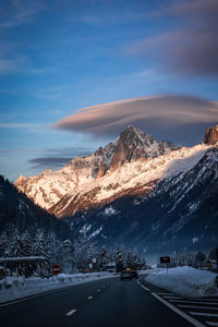 Scenic view of snowcapped mountains against sky during sunset