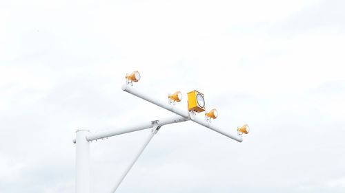 Low angle view of road sign against sky