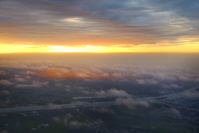 Aerial view of cityscape against sky during sunset