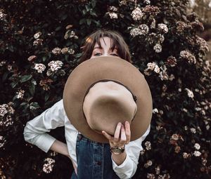 Young woman holding flower