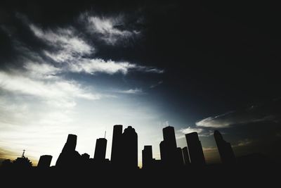 Low angle view of building against cloudy sky