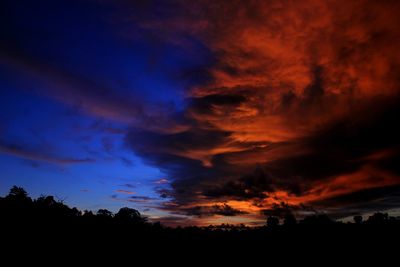 Scenic view of dramatic sky at sunset