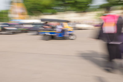 Blurred motion of people on street