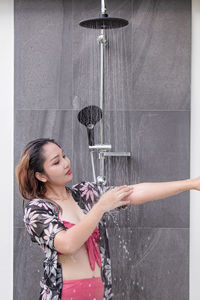 Girl taking a shower.