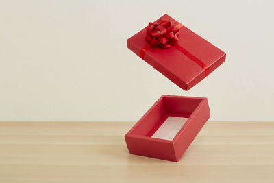 High angle view of red box on table against wall