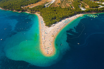 Aerial scene of zlatni rat beach on brac island, croatia