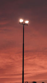 Low angle view of street light against sky during sunset at mugello circuit