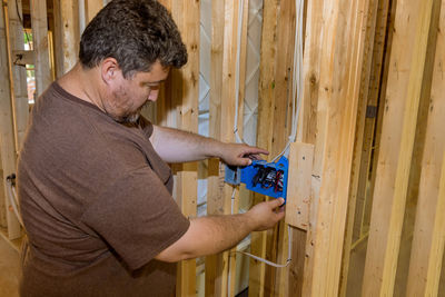 Side view of man working at home