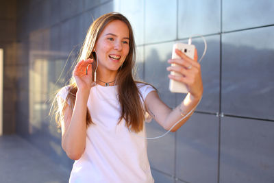 Young woman using mobile phone