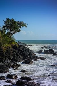 Scenic view of sea against clear blue sky