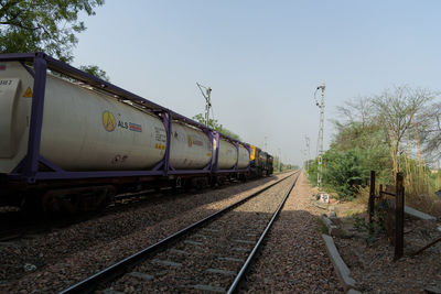 Train on railroad track against sky