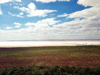 Scenic view of sea against cloudy sky