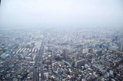 Aerial view of cityscape against clear sky