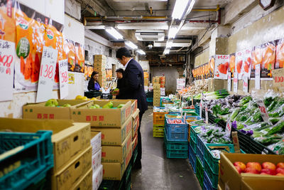 Man for sale at market stall