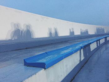 Close-up of swimming pool against blue sky