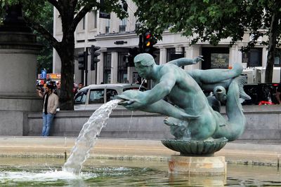 Statue of fountain in city