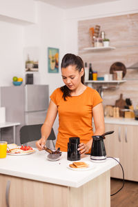 Woman preparing food at home