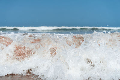 Sea-level photo of the ocean's white foam