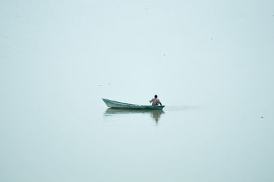 Man on boat in sea