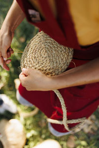 Hands of artisan weaving esparto grass