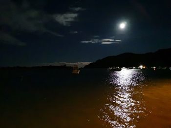 Scenic view of sea against sky at night