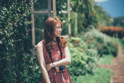 Woman standing in back yard