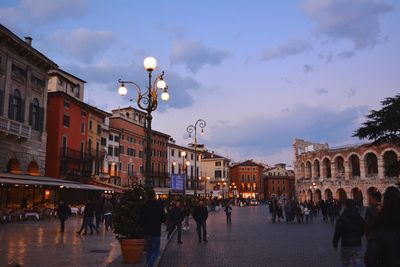 People in city against sky