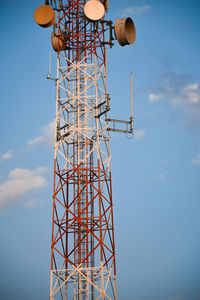 Low angle view of electricity pylon against sky