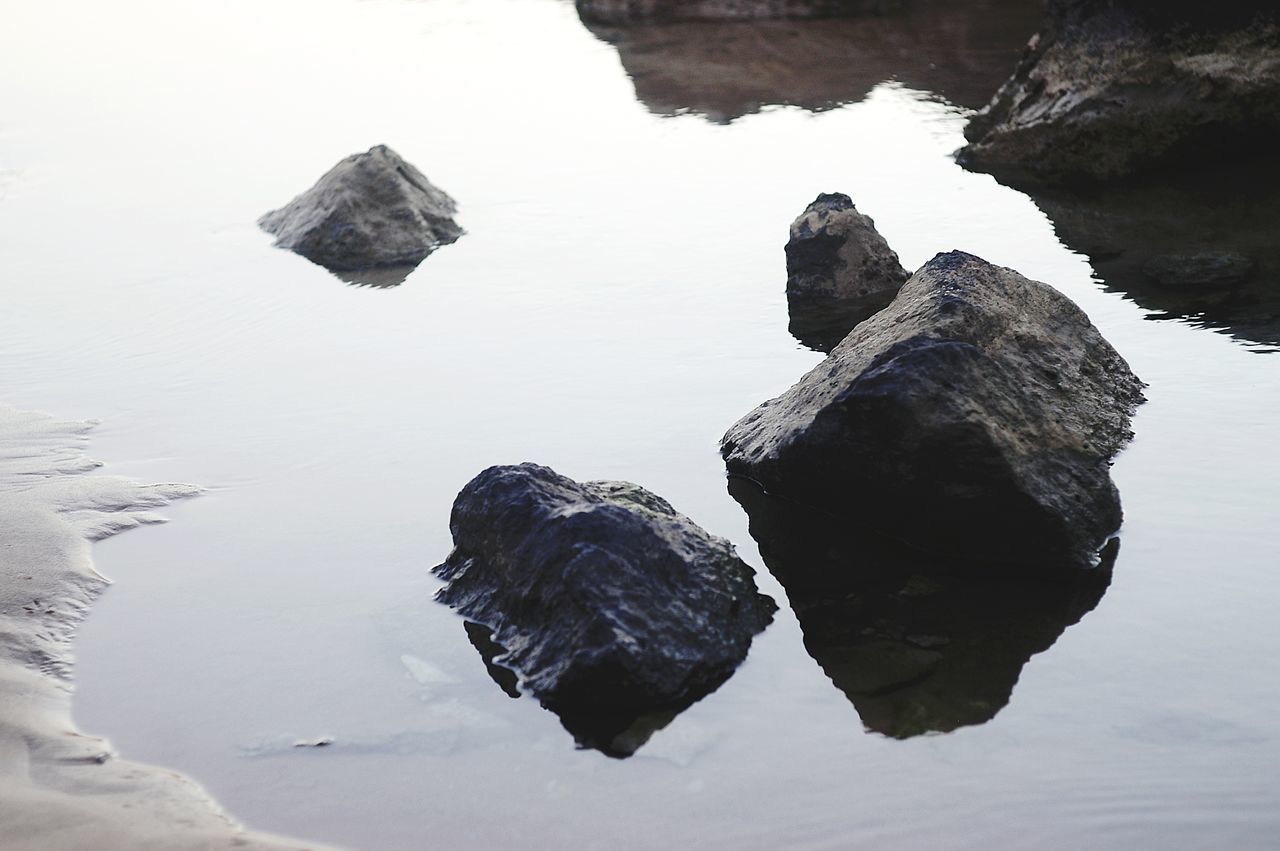 water, reflection, rock, nature, winter, ice, snow, no people, tranquility, beauty in nature, day, lake, outdoors, scenics - nature, sky, land, beach, environment, cold temperature