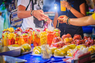 People having food at market stall