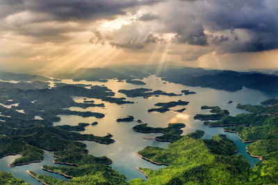 Aerial view of lake against sky at sunset