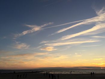 Scenic view of beach against sky during sunset