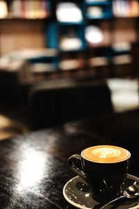 Close-up of coffee cup on table