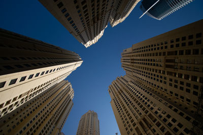 Low angle view of buildings against sky in city