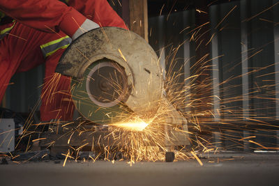 Low angle view of person working at night