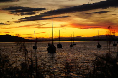 Scenic view of sea against orange sky