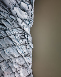 Close-up of stone stack against wall