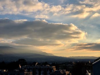 High angle shot of townscape against sky at sunset