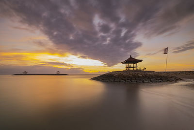 Scenic view of sea against sky at sunset