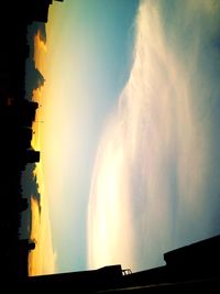 Buildings against sky at sunset