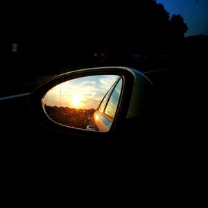 Reflection of car on side-view mirror